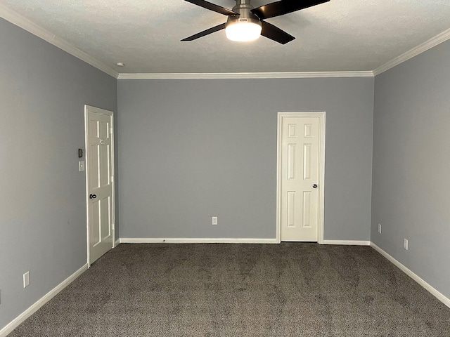 spare room with ornamental molding, dark carpet, baseboards, and ceiling fan