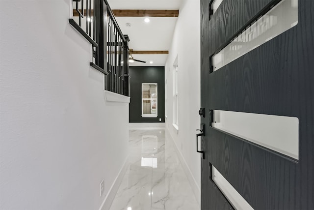 corridor with marble finish floor, baseboards, beam ceiling, and recessed lighting