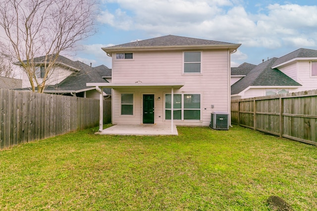 rear view of property featuring a fenced backyard, central AC unit, a lawn, and a patio