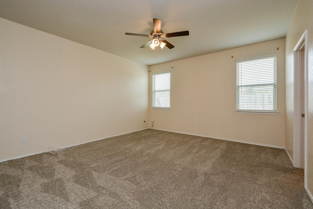 carpeted empty room featuring ceiling fan