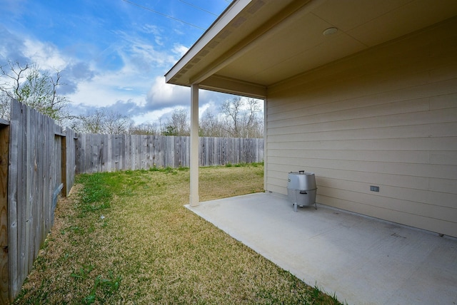 view of yard with a fenced backyard and a patio