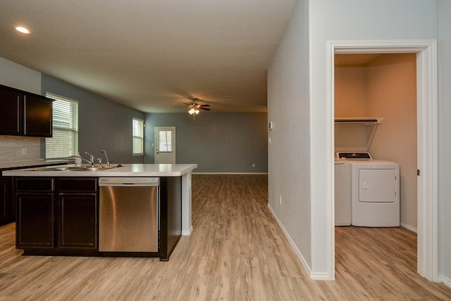 kitchen featuring a sink, a ceiling fan, light countertops, light wood-type flooring, and dishwasher