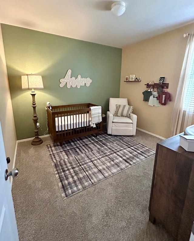 carpeted bedroom with baseboards