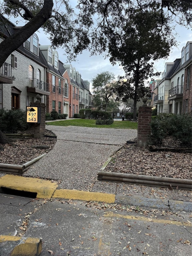 473 N Post Oak Ln Unit 473, Houston, TX 77024 - view of asphalt road with a residential view