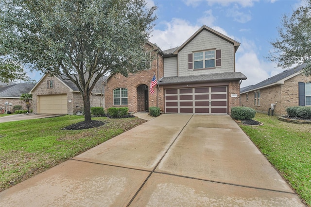 view of front facade with brick siding, an attached garage, concrete driveway, and a front yard