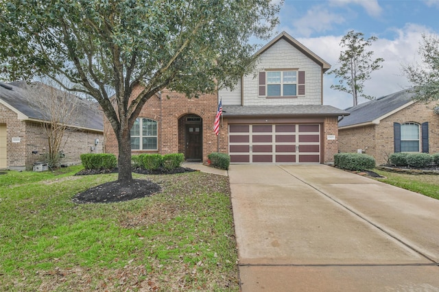 view of front facade with brick siding, a front lawn, an attached garage, and driveway