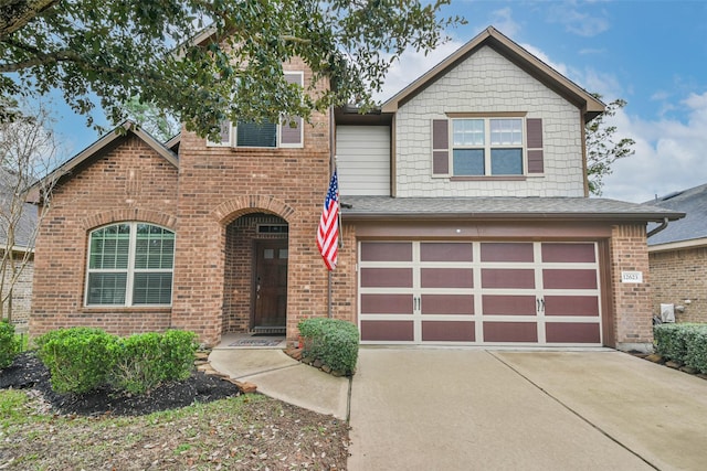 view of front of property featuring concrete driveway, a garage, and brick siding