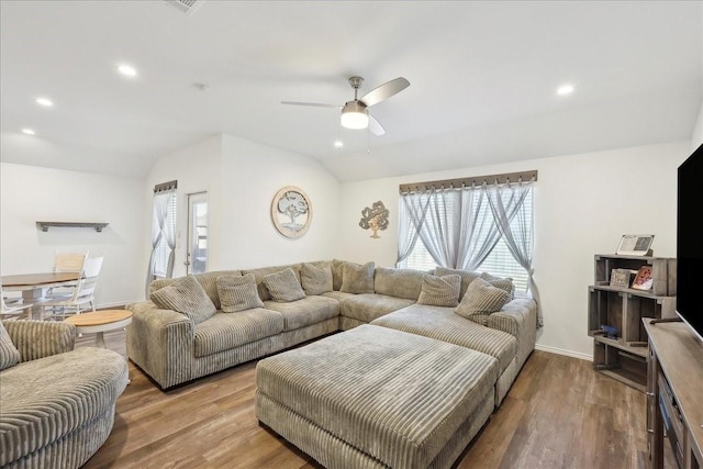 living area with recessed lighting, lofted ceiling, a ceiling fan, and wood finished floors