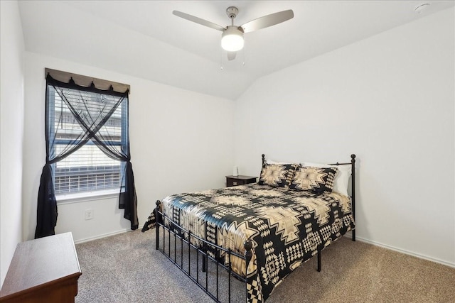 bedroom with carpet flooring, baseboards, and lofted ceiling