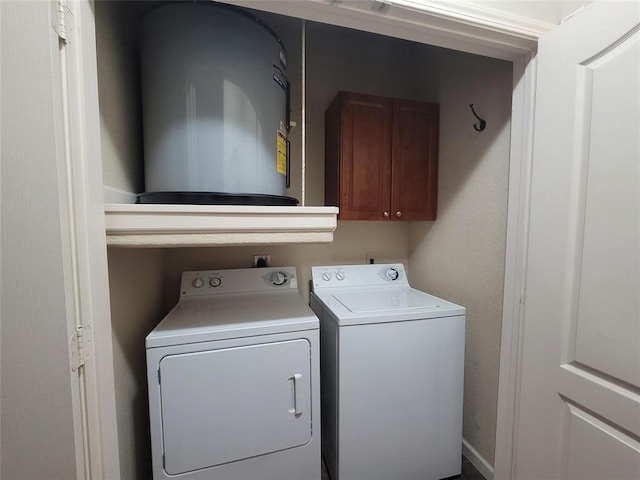 laundry area featuring cabinet space and separate washer and dryer