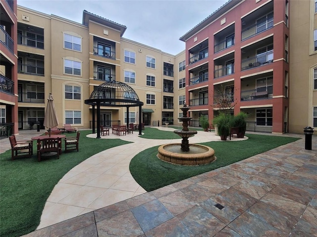 view of property's community with a patio area