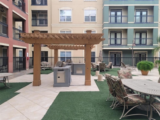 exterior space with a pergola and stucco siding