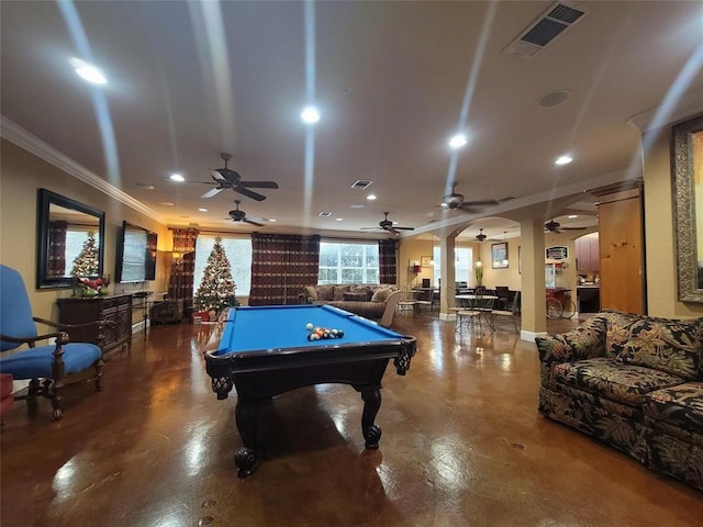 playroom with concrete floors, visible vents, arched walkways, and crown molding