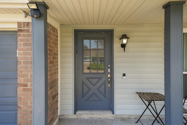 entrance to property with brick siding