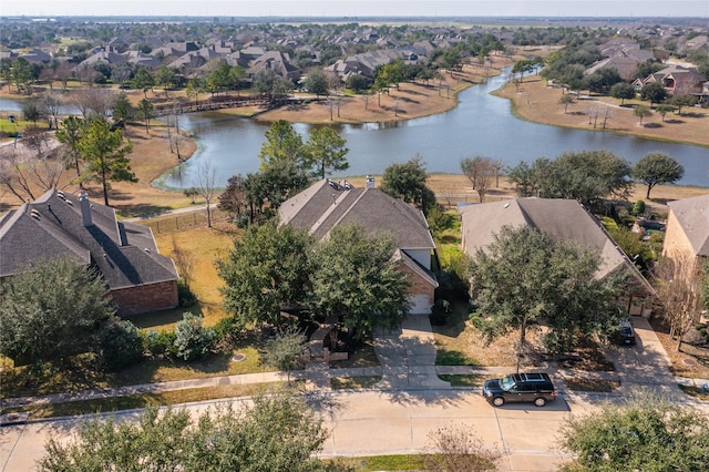 drone / aerial view with a residential view and a water view