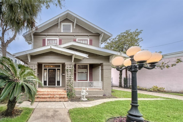 view of front facade with a porch and a front yard