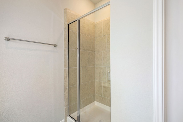 full bath featuring a stall shower