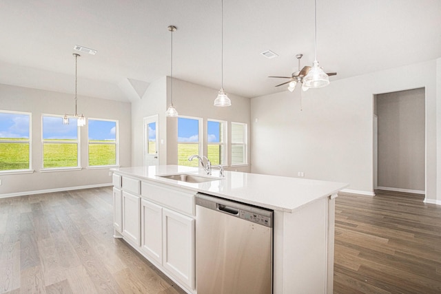 2102 Twin Lakes Blvd, West Columbia, TX 77486 - kitchen featuring stainless steel dishwasher, light wood-style floors, open floor plan, ceiling fan, and vaulted ceiling