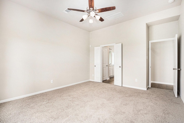 2102 Twin Lakes Blvd, West Columbia, TX 77486 - unfurnished bedroom featuring carpet floors, connected bathroom, and ceiling fan