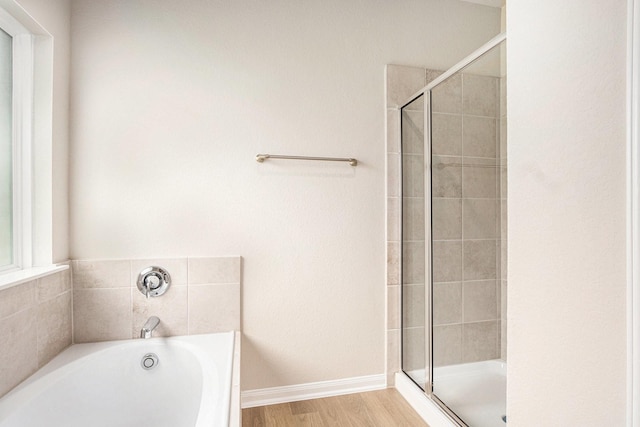 2102 Twin Lakes Blvd, West Columbia, TX 77486 - full bathroom with a stall shower, a bath, and wood finished floors