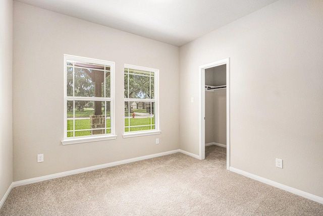 2102 Twin Lakes Blvd, West Columbia, TX 77486 - unfurnished bedroom with carpet and a spacious closet
