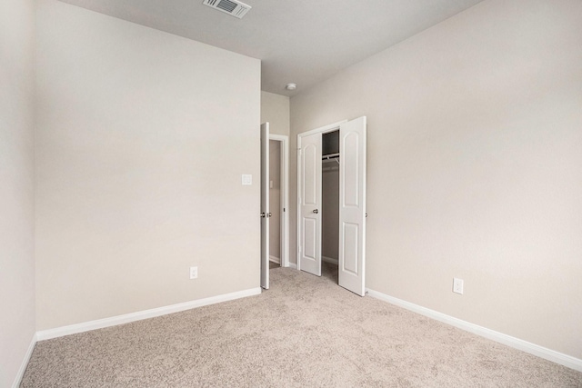 2102 Twin Lakes Blvd, West Columbia, TX 77486 - unfurnished bedroom featuring light carpet and a closet