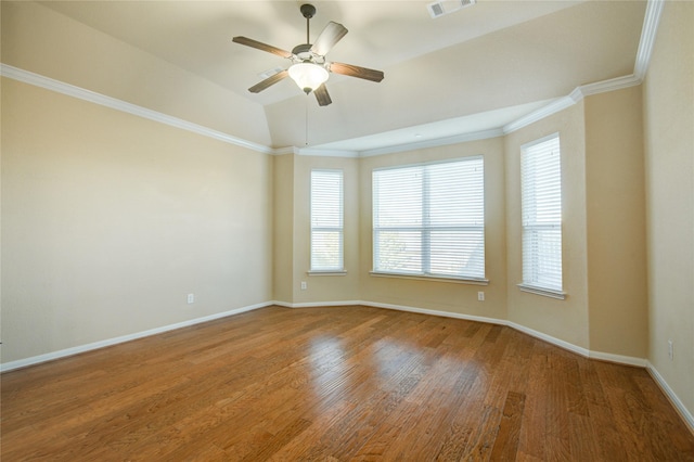 unfurnished room featuring visible vents, baseboards, ceiling fan, wood finished floors, and crown molding