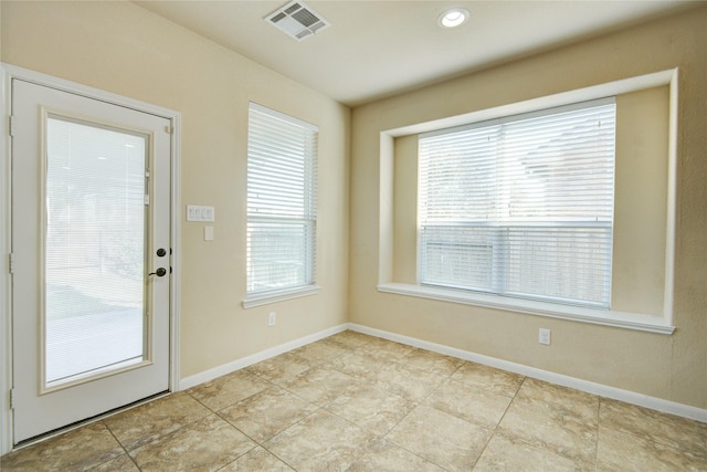 entryway featuring visible vents and baseboards