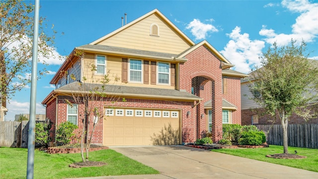 traditional-style home featuring a front yard, brick siding, fence, and driveway