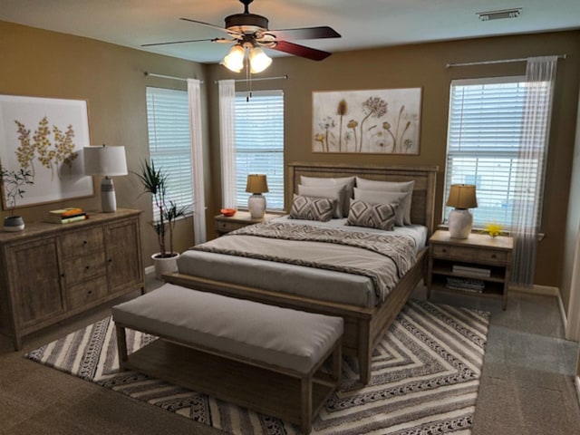 bedroom with a ceiling fan, visible vents, and carpet flooring