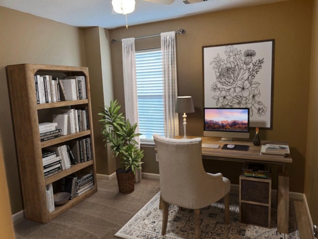 office area with carpet floors, baseboards, and a ceiling fan