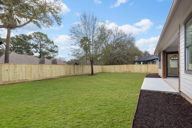 view of yard featuring a fenced backyard