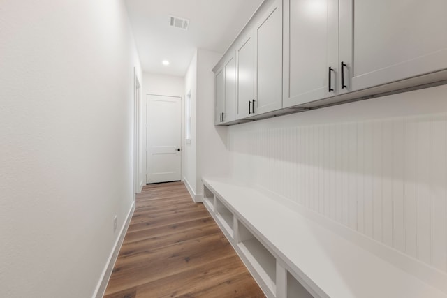 mudroom featuring recessed lighting, wood finished floors, visible vents, and baseboards