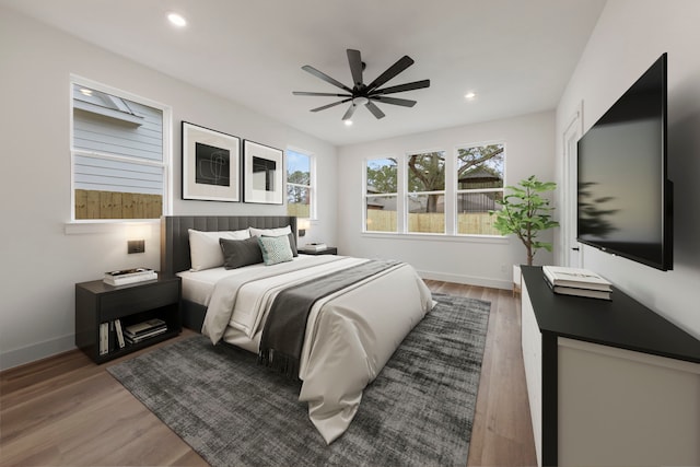 bedroom featuring recessed lighting, baseboards, and wood finished floors