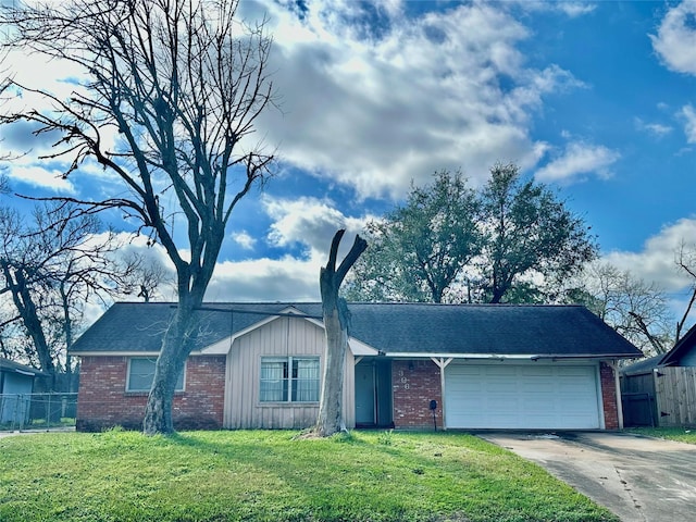 ranch-style home with driveway, a front lawn, an attached garage, and fence