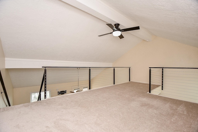 653 Davis Rd, League City, TX 77573 - additional living space with a textured ceiling, vaulted ceiling with beams, a ceiling fan, and carpet