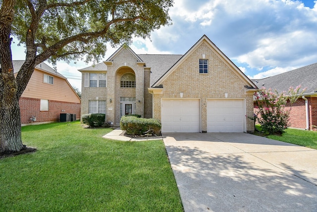 traditional home featuring a garage, brick siding, concrete driveway, central air condition unit, and a front yard