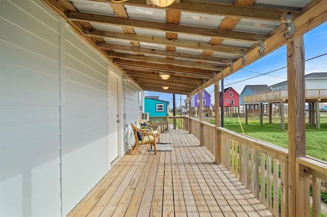 wooden deck featuring a yard