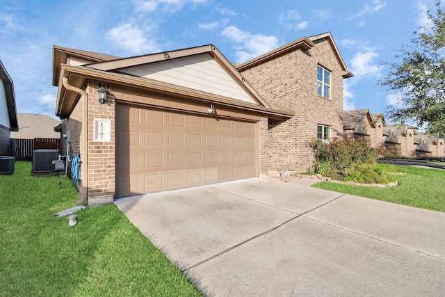 view of front of property with concrete driveway, brick siding, an attached garage, and a front yard