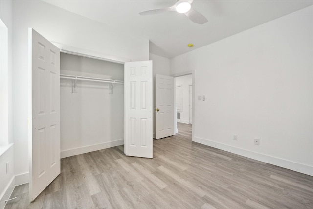 unfurnished bedroom featuring a ceiling fan, baseboards, light wood-type flooring, and a closet