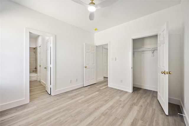 unfurnished bedroom with light wood finished floors, baseboards, and a closet