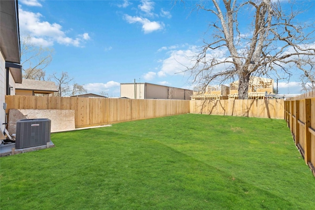 view of yard featuring cooling unit and a fenced backyard