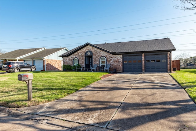 view of front of property with brick siding, a shingled roof, concrete driveway, an attached garage, and a front yard