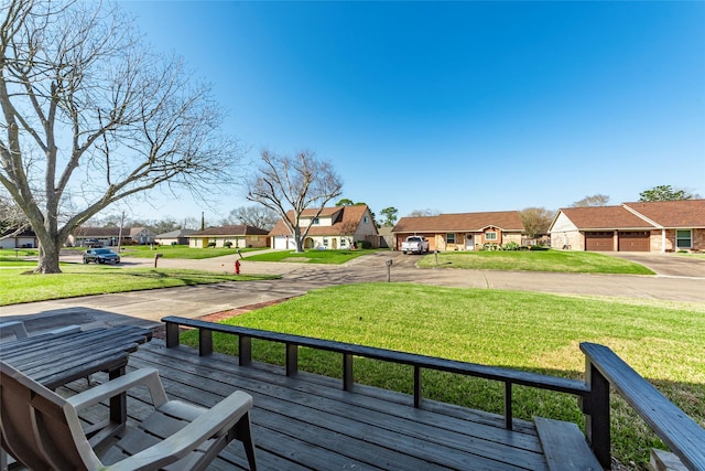 exterior space with a residential view and a yard