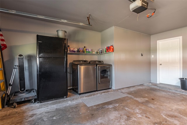 garage featuring washing machine and dryer, freestanding refrigerator, and a garage door opener