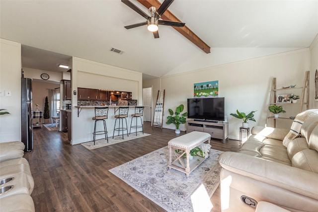 living area with lofted ceiling with beams, dark wood-type flooring, visible vents, and a ceiling fan