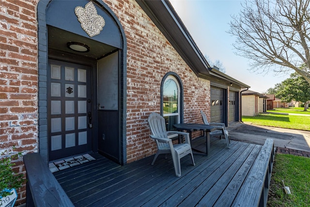 wooden terrace featuring a garage