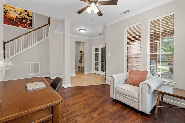 home office with dark wood-type flooring, visible vents, ornamental molding, and baseboards