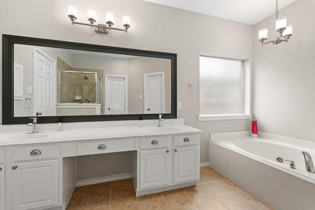 full bath with a stall shower, a garden tub, a sink, and double vanity