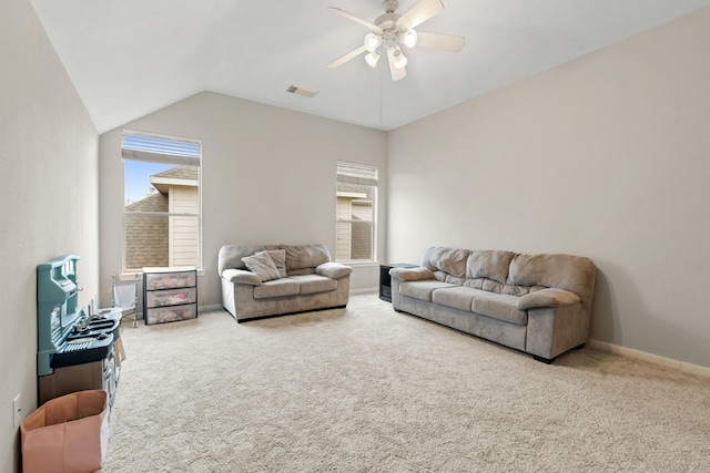 carpeted living area featuring a ceiling fan, lofted ceiling, visible vents, and plenty of natural light